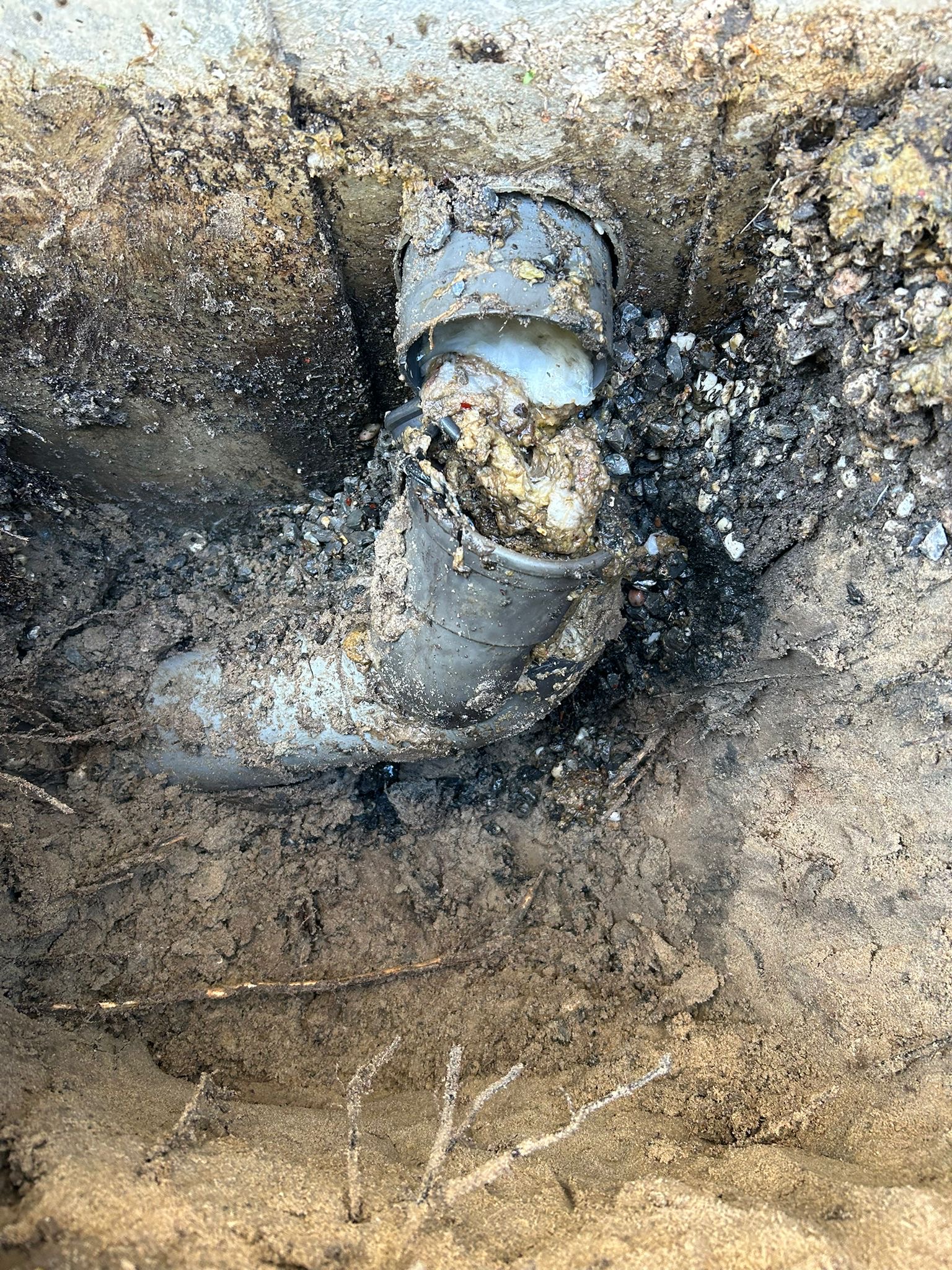 a person fixing a sink